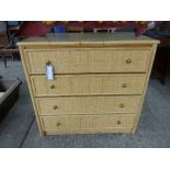 A rattan chest of four long drawers