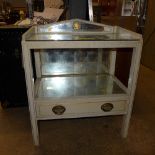 A two tiered mirrored side table with open shelf and single drawer and gallery back H75 x W60 x D39