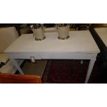 A pair of Howard & Sons grey painted console tables each fitted two drawers on square tapering