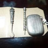 A hallmarked silver vesta case and two silver etui pieces