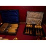 A cased set of six hallmarked silver tea spoons of silver plated fish knives and forks