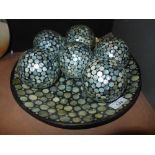 A contemporary mosaic plate and six matching spheres