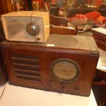 A walnut vintage radio together with an