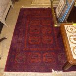 A Persian style C20th red ground,