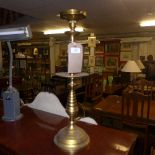 A pair of gilt metal table lamps in the form of ecclesiastical pricket sticks