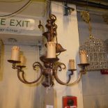 A pair of 'coppered' six branch chandeliers in the Dutch style with celluloid candle sconces