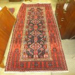 A fine North East Persian Meshad Belouch rug 245 cm x 120 cm repeating chain like pole medallion on
