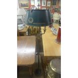 A Regency design twin branch standard lamp with green painted to toleware shade