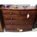 A C19th/ late George III mahogany bowfronted chest fitted two short and three long drawers with