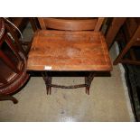 An early C20th oak drop flap dining/breakfast table and a nest of two tables (3)