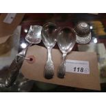 A collection of four hallmarked silver caddy spoons, including a 1940's example in the form of a cap