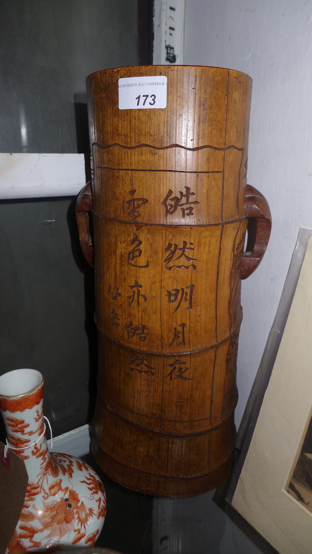 A Chinese Qing dynasty artist's brush pot in carved bamboo 16'' tall, with an inscribed and signed