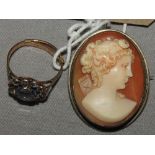 A cameo brooch/pendant with female portrait detail and a yellow metal ring set faux amethyst and