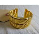 A large Italian designer clamp form bracelet stamped Ferre made in Italy