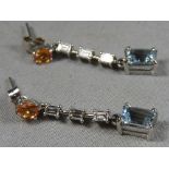 A pair of 14ct square cut diamond and aquamarine earrings.