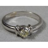 A C14ct white gold solitaire diamond ring.
