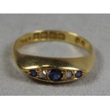 A Victorian 18ct yellow gold ring set in alternating diamonds and sapphires.