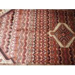 A fine North West Persian Hamadan rug with central diamond medallion with repeating stylized