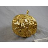 A 20th century/contemporary gilt cased model of a half eaten apple by Elbracha