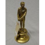 A bronzed gilt figure of a bowls player on stand