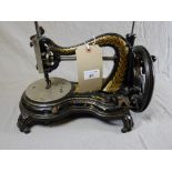 A 20th century ebonised hand powered sewing machine,