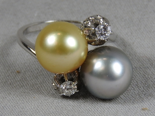 An C18th white gold ladies dress ring set twin diamonds and two colour pearls.