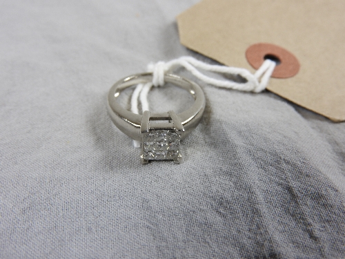 A gentleman's platinum dress ring set nine diamonds in a square setting