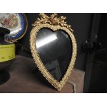 An Edwardian design gilt metal heart shaped photograph frame with stand