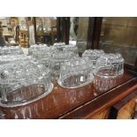 A collection of various glass Jenny moulds.