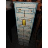 A pair of yellow painted pine open shelves and narrow chest with sea shell decoration (2)