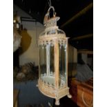 A classical style cream painted wrought iron and glass hanging lantern - H70cm