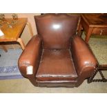 An early C20th French faux leather club armchair H 75 cm x D 80 cm