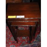 An Edwardian mahogany nest of three low/coffee tables on slender supports - 67 x 48 x 34cm
