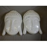 A pair of contemporary white painted wall hanging Buddha heads