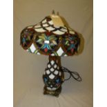 A Tiffany style lamp with opaque and coloured glass shade - H55cm A/F (damage to the base)