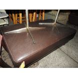 A 20th century contemporary footstool, upholstered in faux brown leather