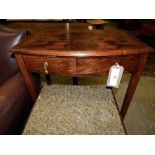 A 19th century Victorian mahogany bowfronted table with frieze drawer on square tapering