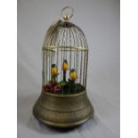 An Edwardian design automatom in the form of a brass cage with wind-up singing birds