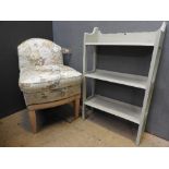 A three tiered grey painted shelf unit, along with a 1920s nursing chair in floral upholstery (2)