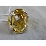 A large 18ct yellow gold gentlemans dress ring set oval citrine within diamond filled star form