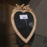 An ormolu heart shaped photo frame