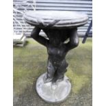 A faux stone plinth of a cherub holding a table 70cm (h)