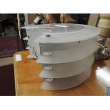 A pair of Art Deco style opaque four tiered wall lights