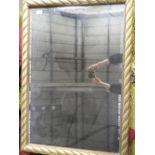 A contemporary wall hanging mirror with bevelled plate within rope twist frame 102 x 70cm