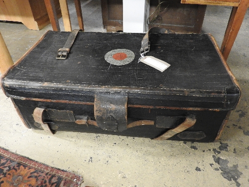 A vintage/early 20th leather and black canvas trunk by cane with target motif and brown leather