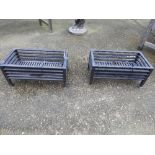 A pair of wrought iron fire grates 25 x 56 x 30cm