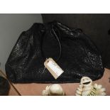 A Fendi black leather ladies bag with impressed decoration and loop handles