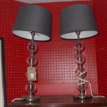 A pair of designer glass table lamps of