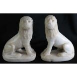 PAIR OF 17TH C. ITALIAN MARBLE LIONS seated on oval base, 5.75”h Age wear to nose and mouth area.