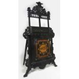 AESTHETIC MOVEMENT EBONIZED FOLIO STAND late 19th c., carved ebonized easel, the fall-front inlaid